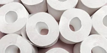 Toilet paper on pink background