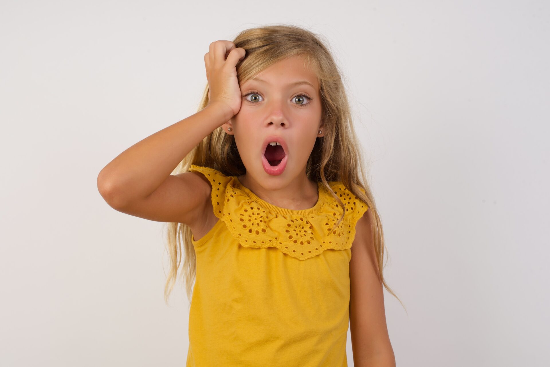 Child looking shocked at something in front of her