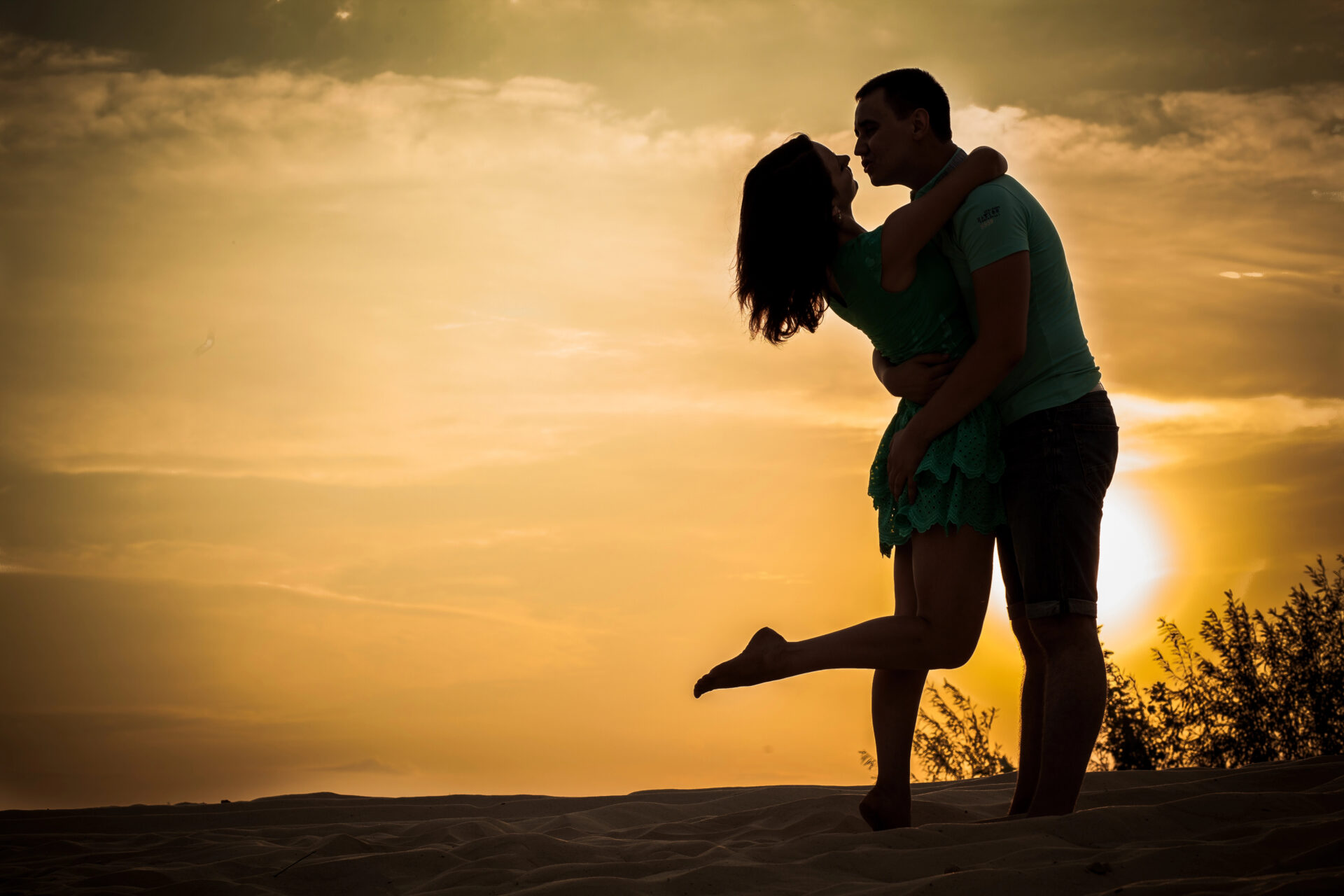 couple in love in the sunset at the beach