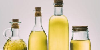 Cooking Oils Tested for Phthalates Guide with Cooking oils in glass bottles in background