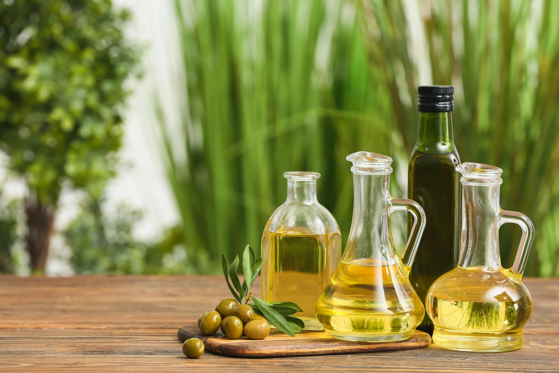 Cooking oils with grass and trees in the background