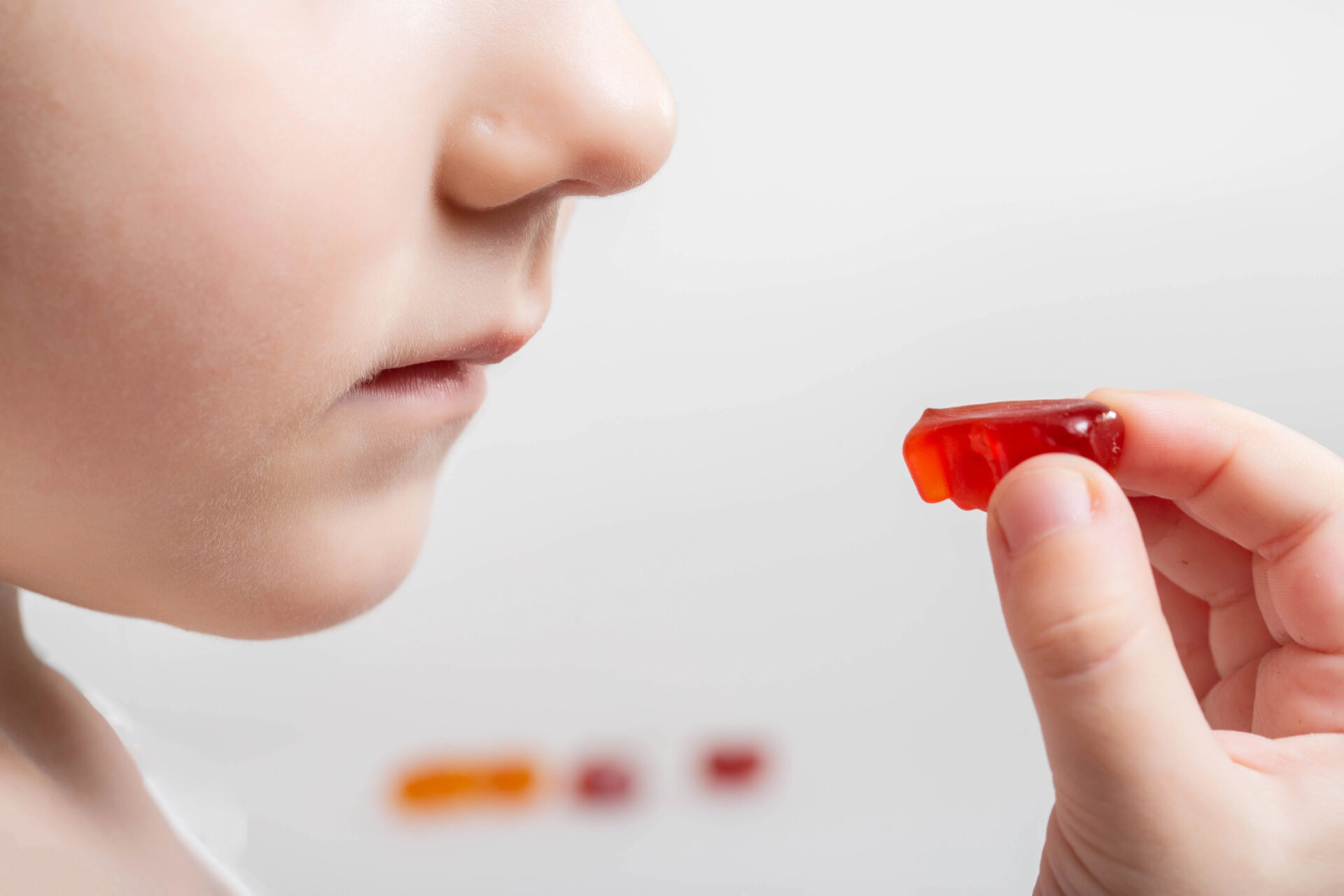 young child takes their children's multivitamins after they were tested for pesticides, PFAS, phthalates, & heavy metals 