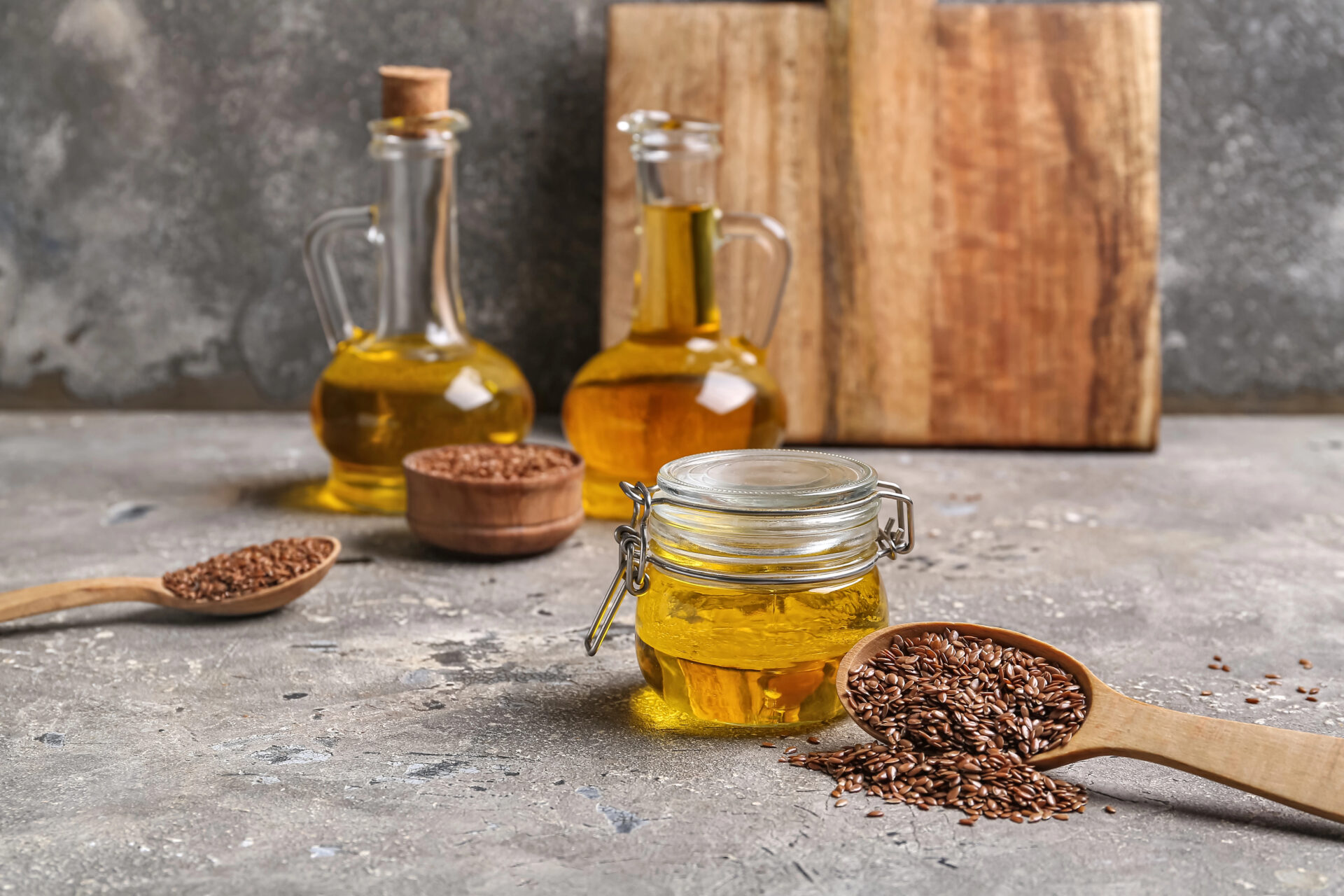 Flaxseed oil in a bottle sitting next to other flaxseed oil