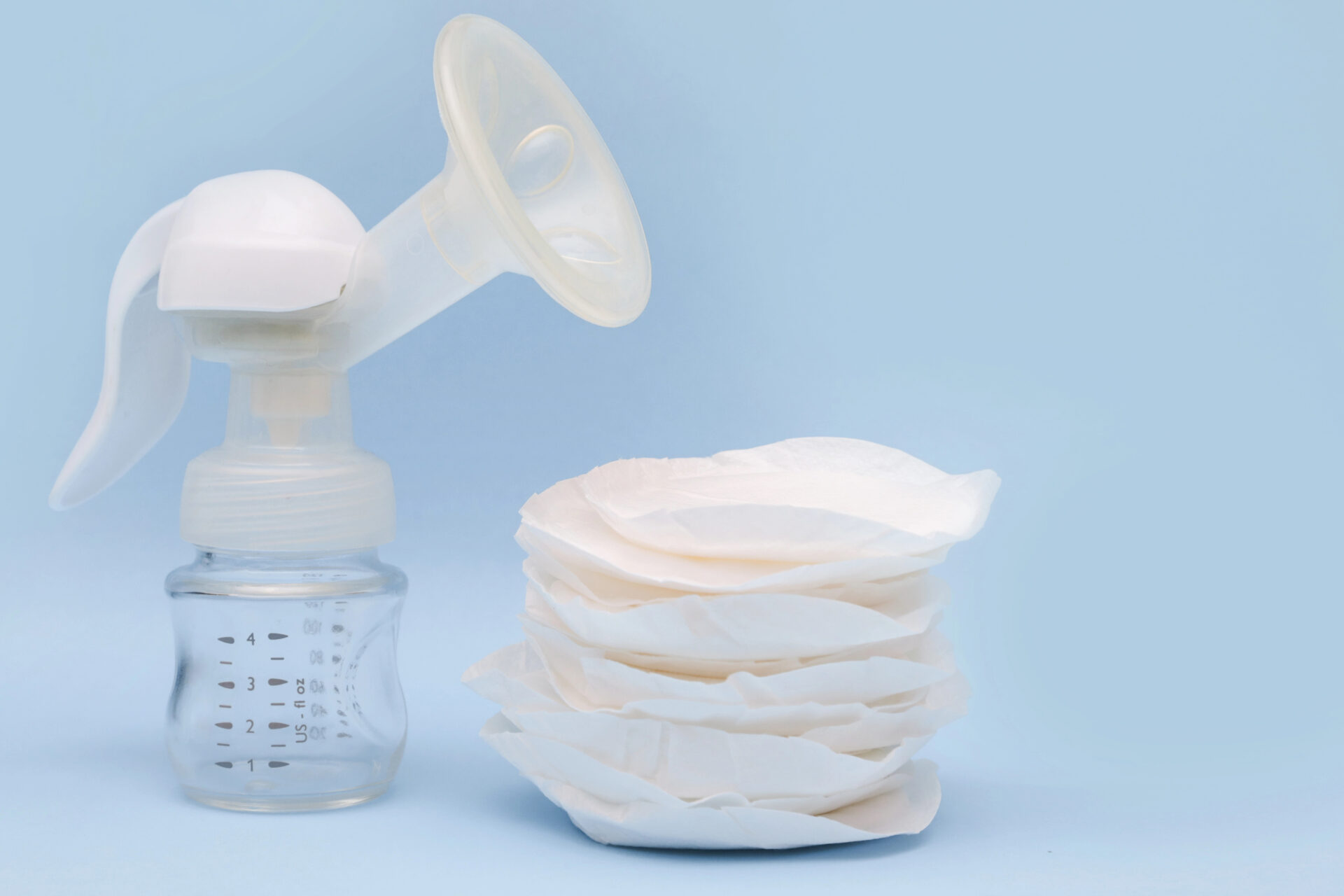 Nursing pads and a nursing pump on a table