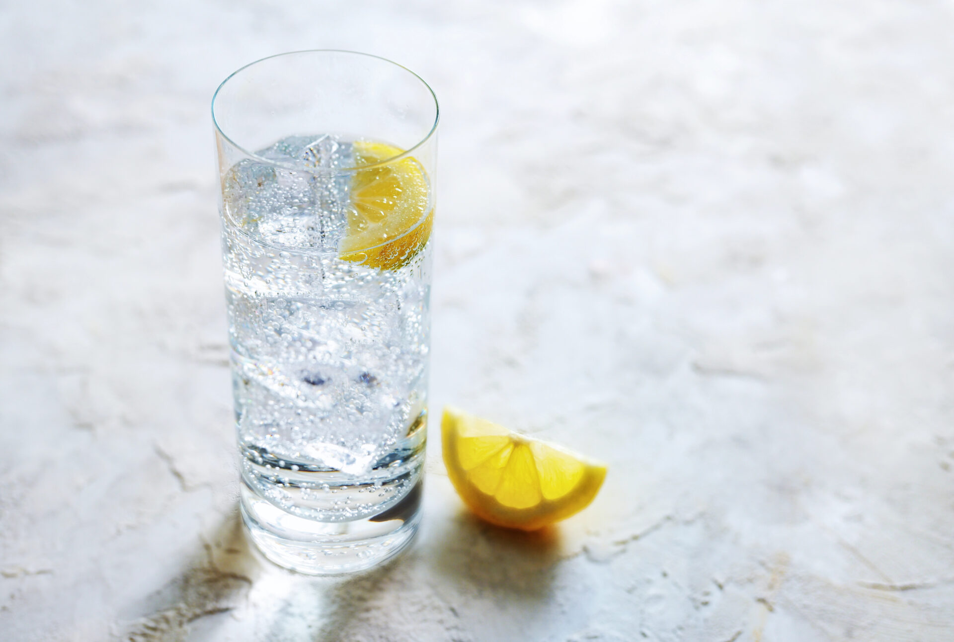 Safest seltzer water tested for PFAS "forever chemicals" on the table with a lemon