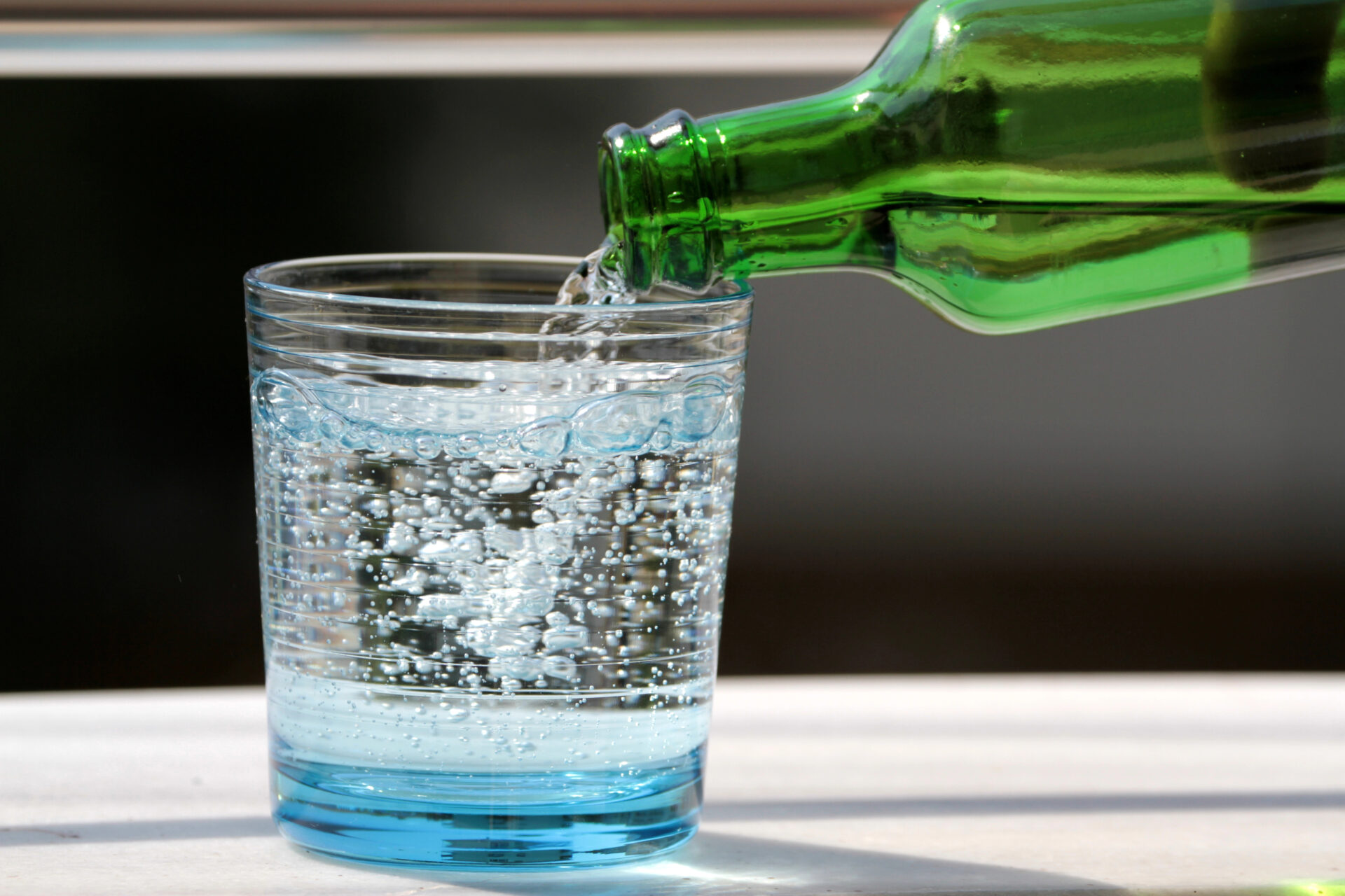 Sparkling water also called mineral water being poured on the table