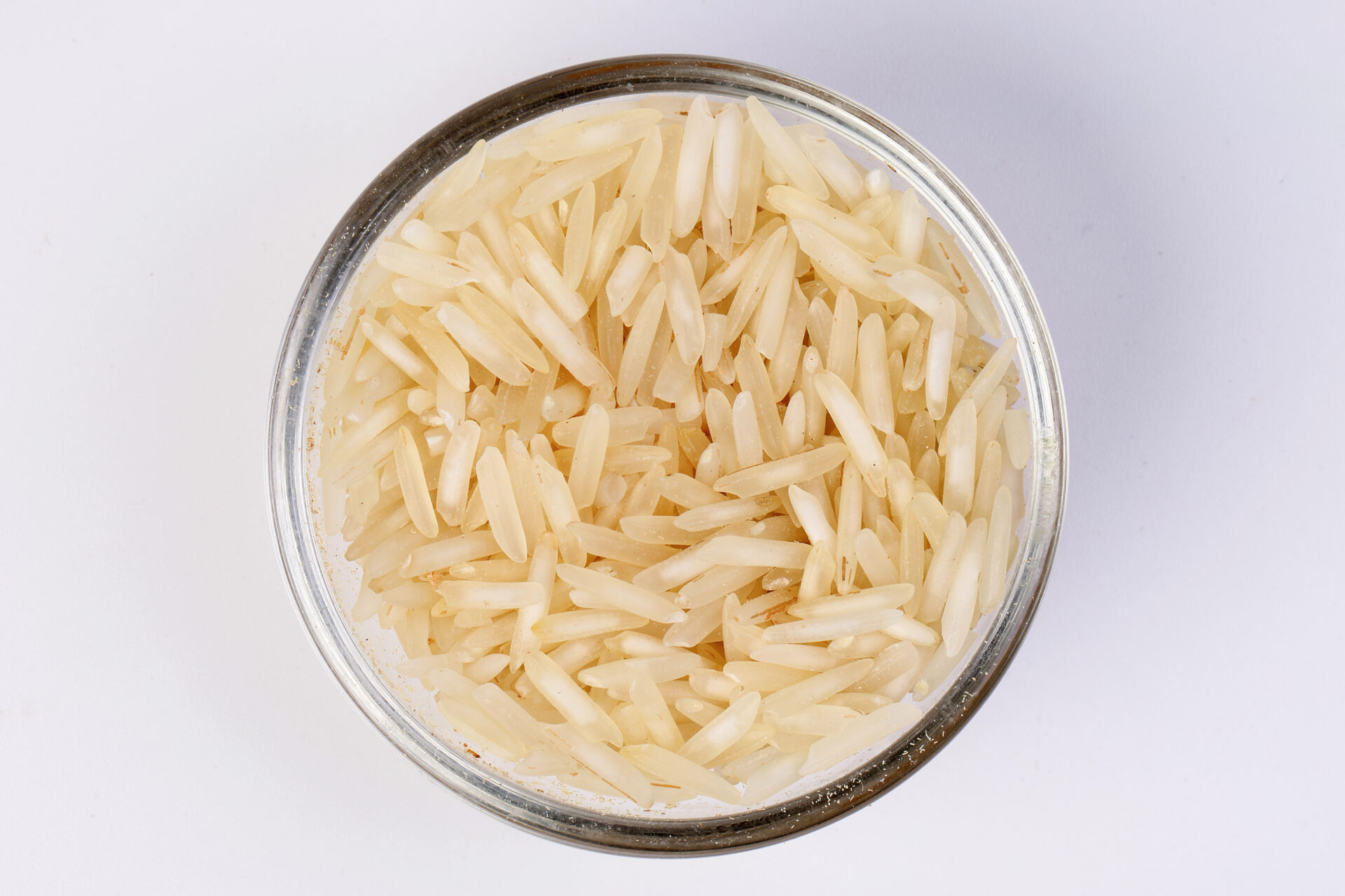 Dry jasmine rice in a glass cup