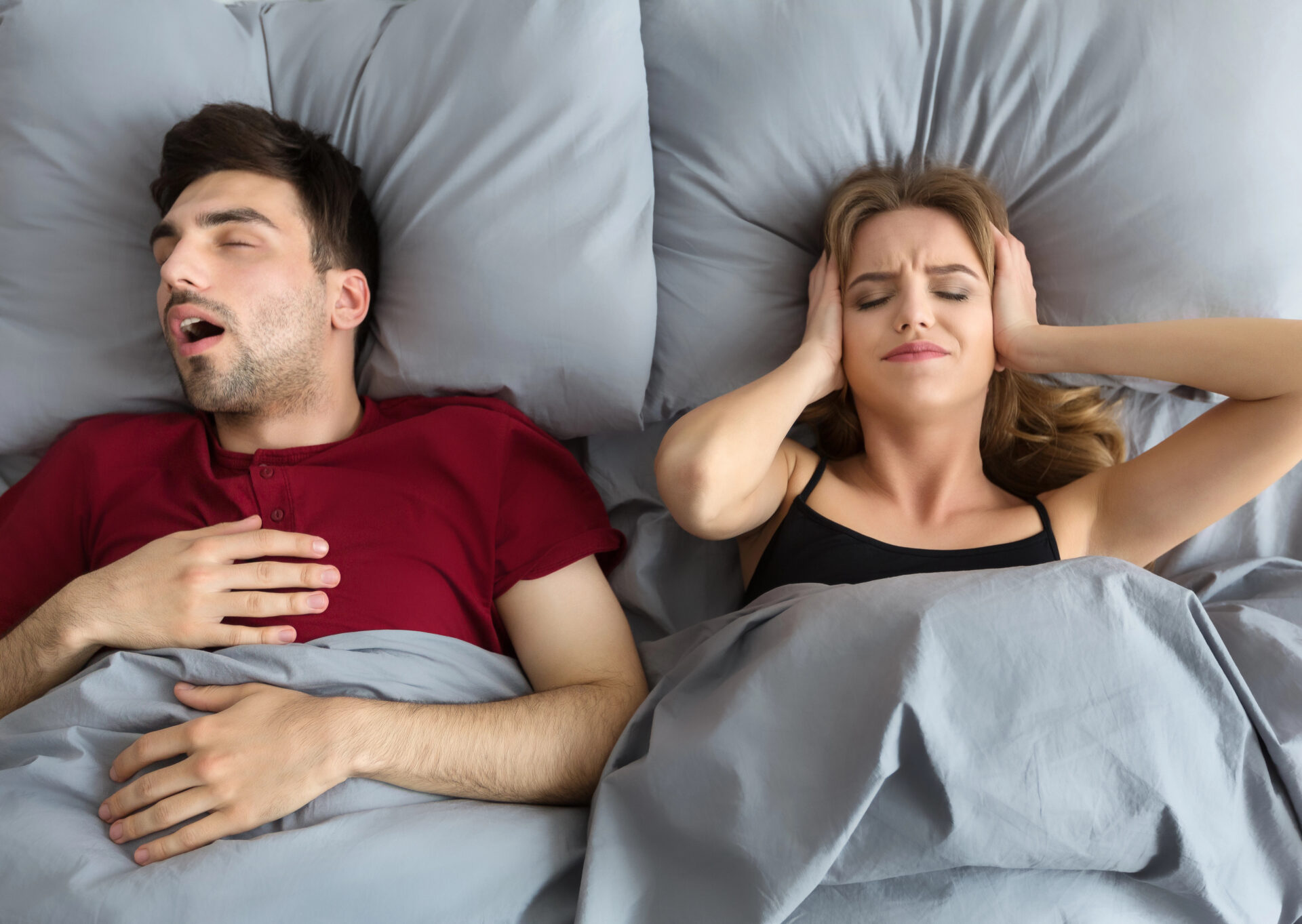 Woman going crazy from husband snoring in bed
