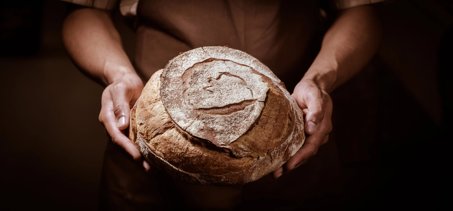 woman holding Sourdough Bread 