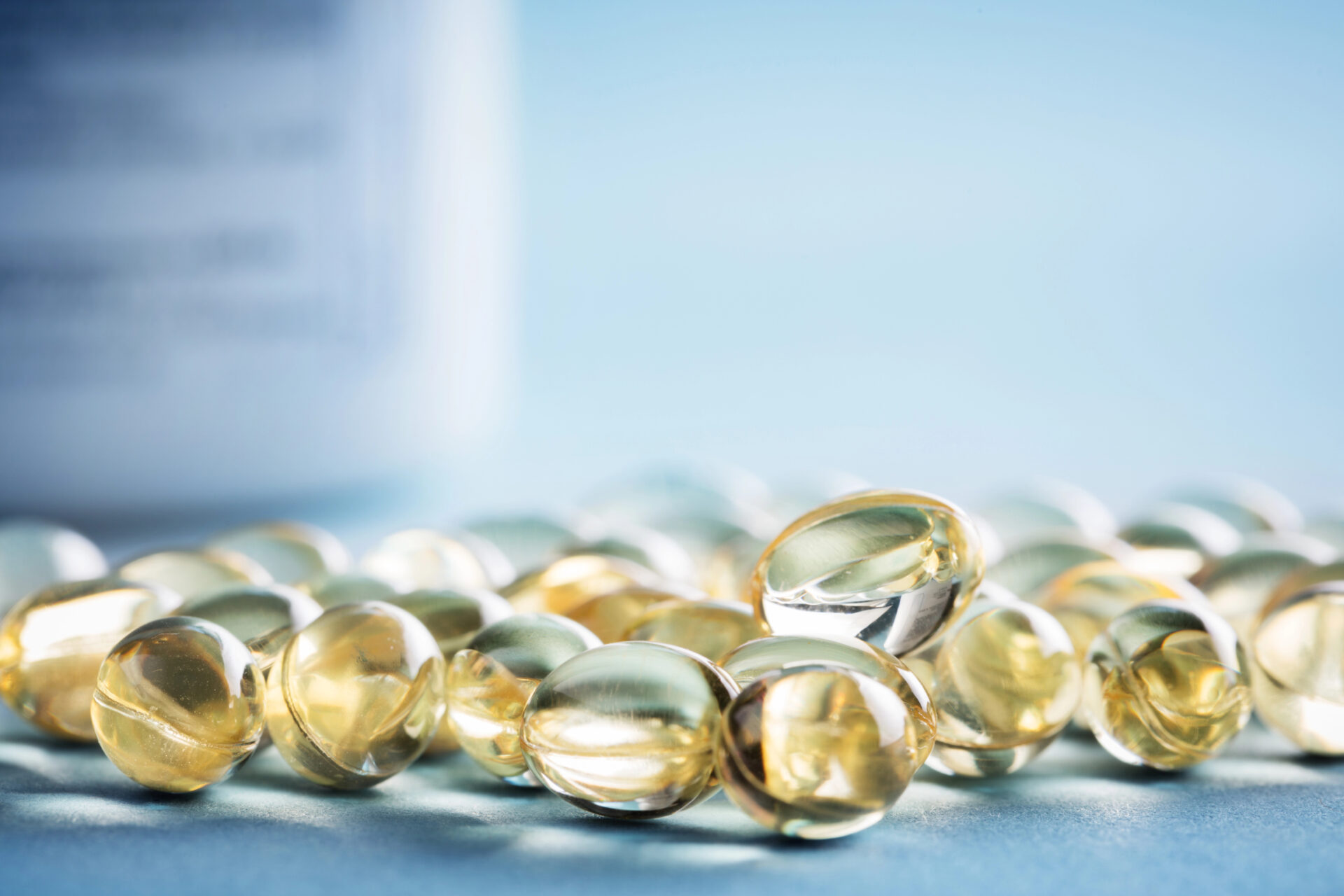 Vitamin D Supplements on a blue table