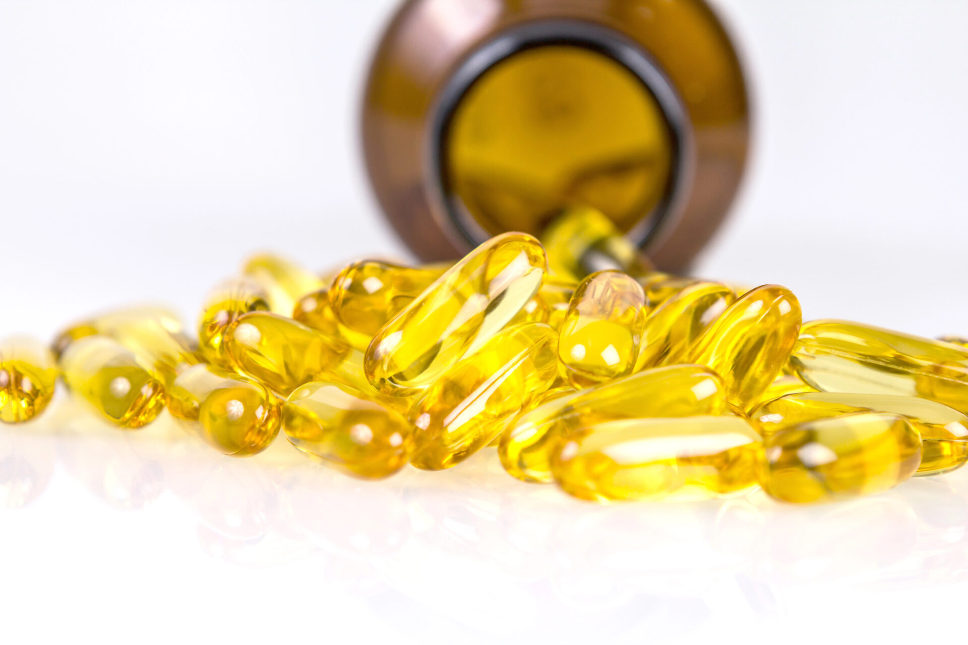 Closeup the yellow soft gelatin supplement capsule