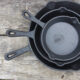 Cast Iron Cookware in threes on a table