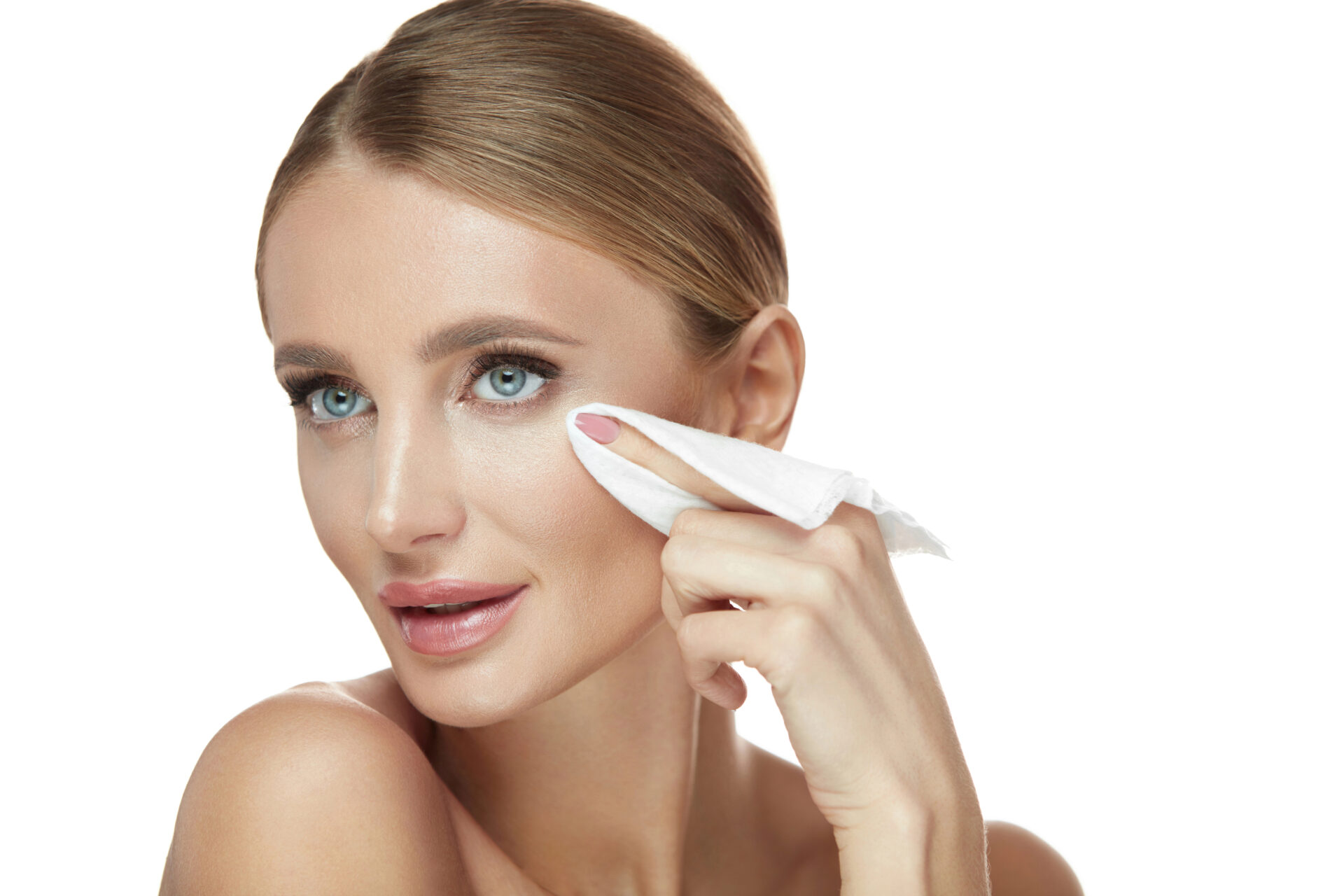 Woman using makeup removal wipe