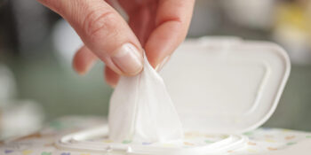 Hand picked a wet wipes in package box, Wet wipes in a woman's hand