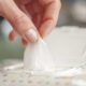 Hand picked a wet wipes in package box, Wet wipes in a woman's hand